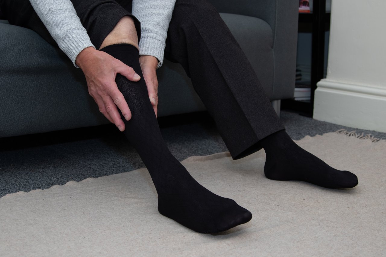 Adult man wearing Activa compression socks.